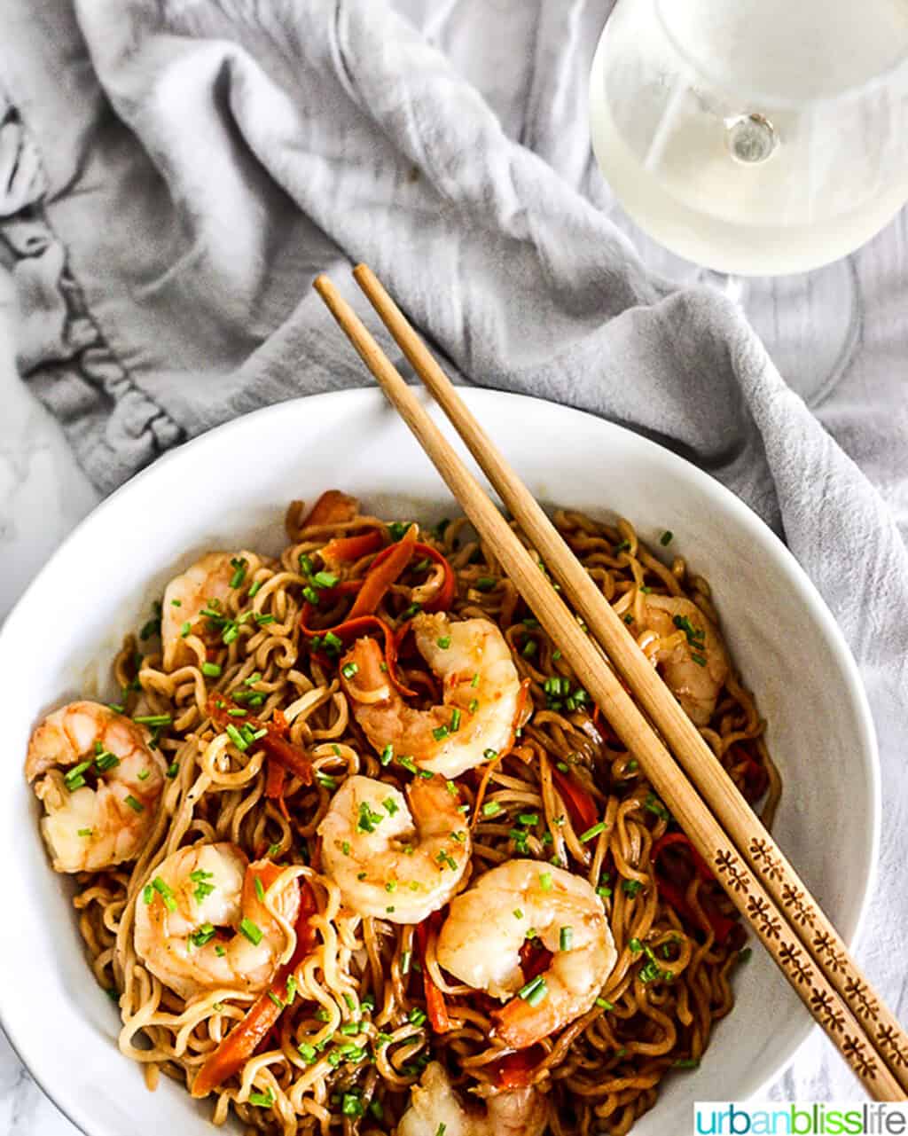 Shrimp Lo Mein Noodles with glass of  white wine