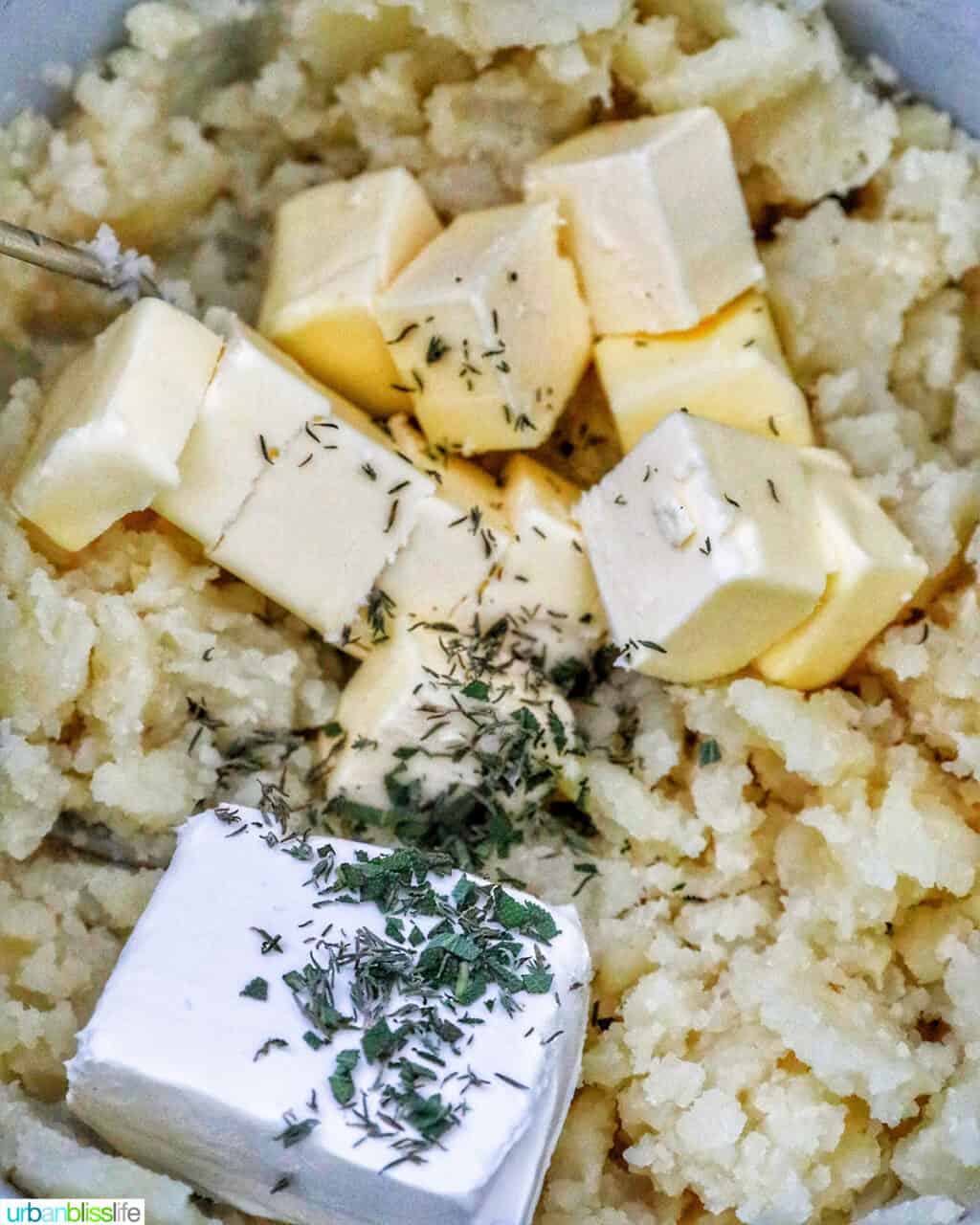 fresh herbs added to garlic mashed potatoes