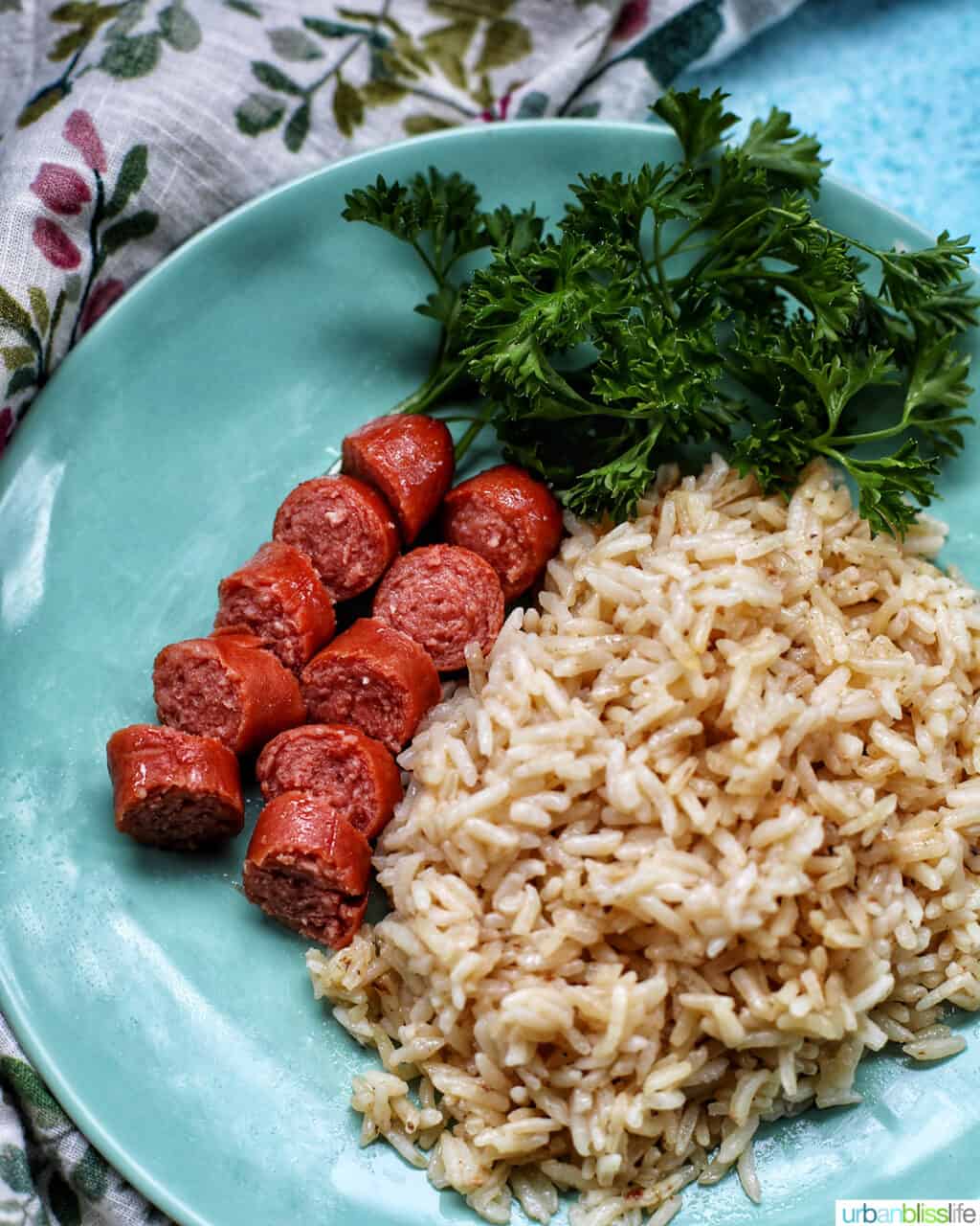 hot dogs with garlic rice on a plate