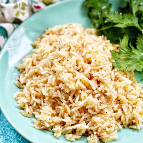 instant pot garlic rice on green plate