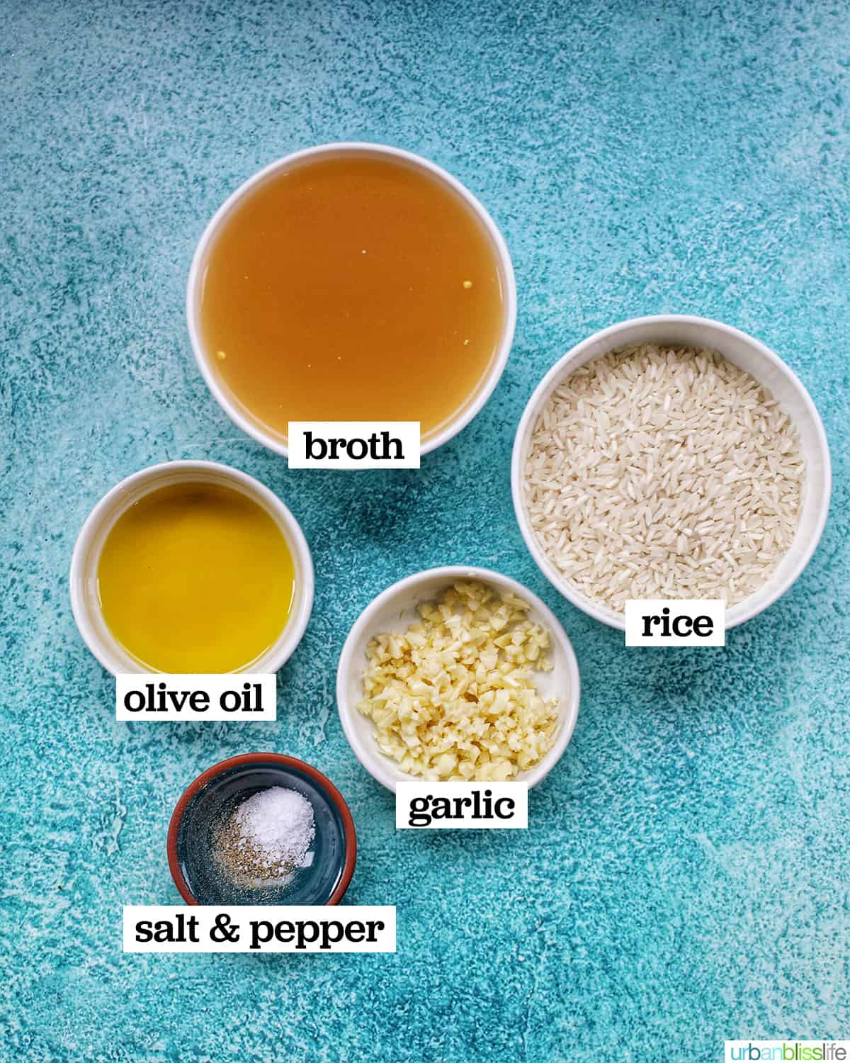 ingredients in individual bowls to make instant pot garlic rice on a bright blue background.