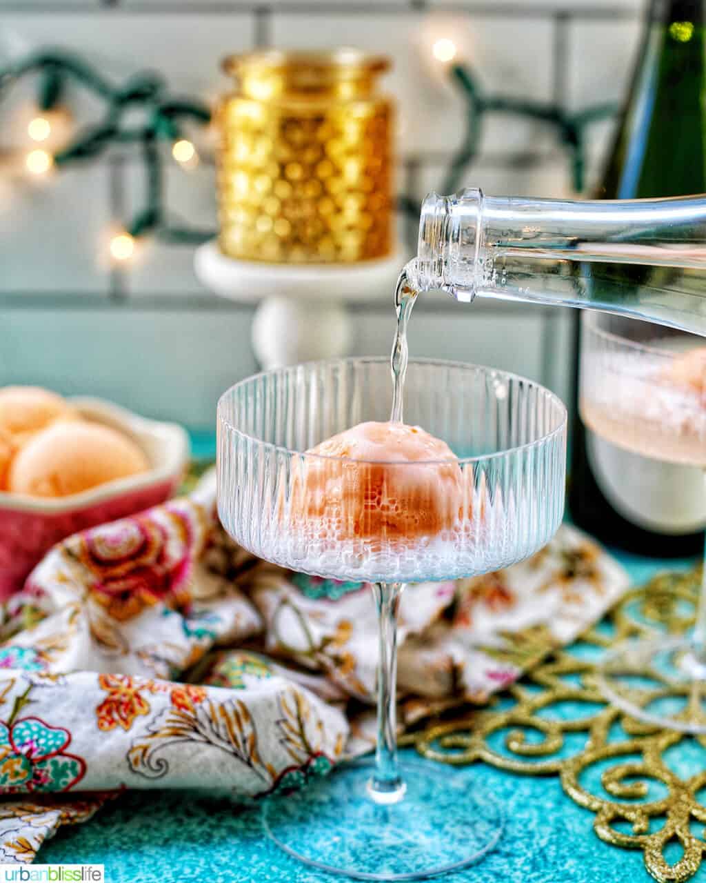 pouring champagne over sherbet into a glass