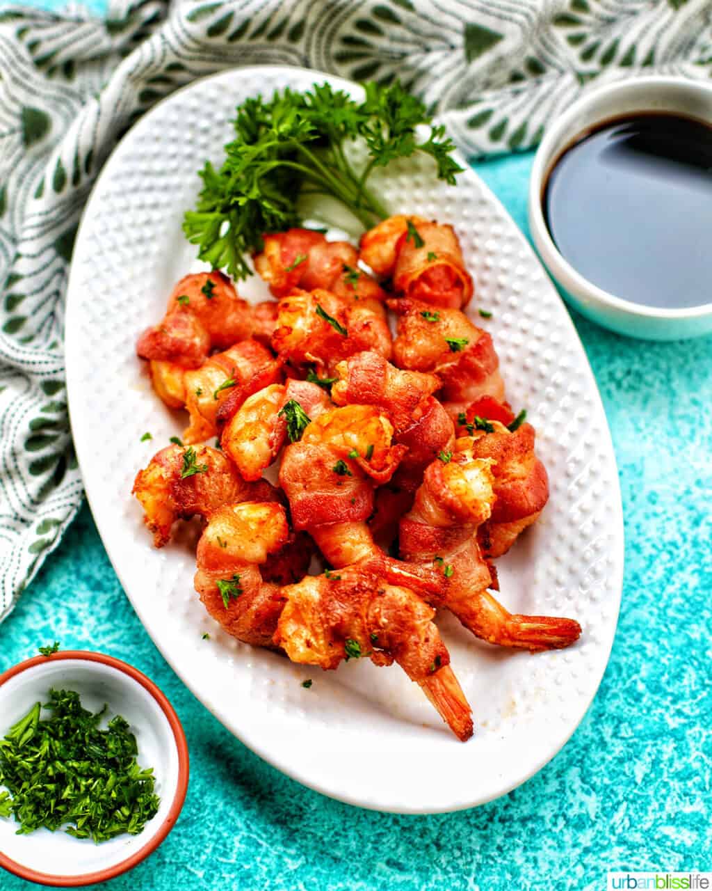 air fryer bacon wrapped shrimp on a white plate