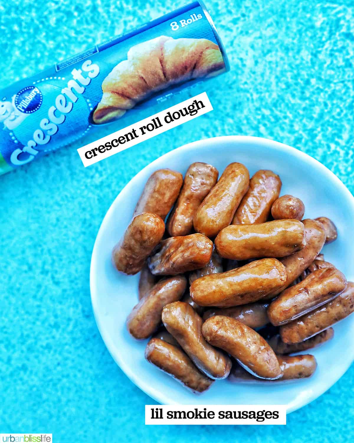 2 ingredients to make Air Fryer Pigs in a Blanket on a bright blue background.