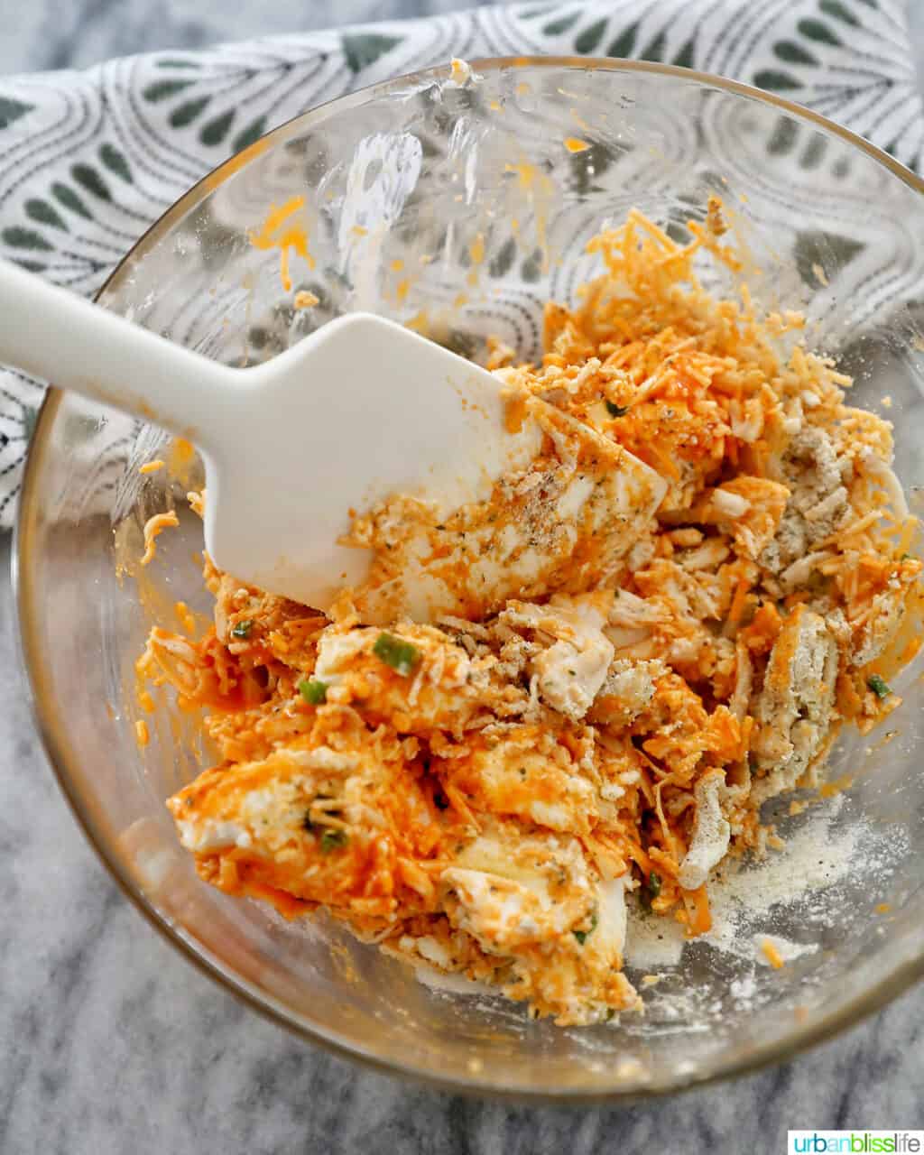mixing ingredients for buffalo chicken bites