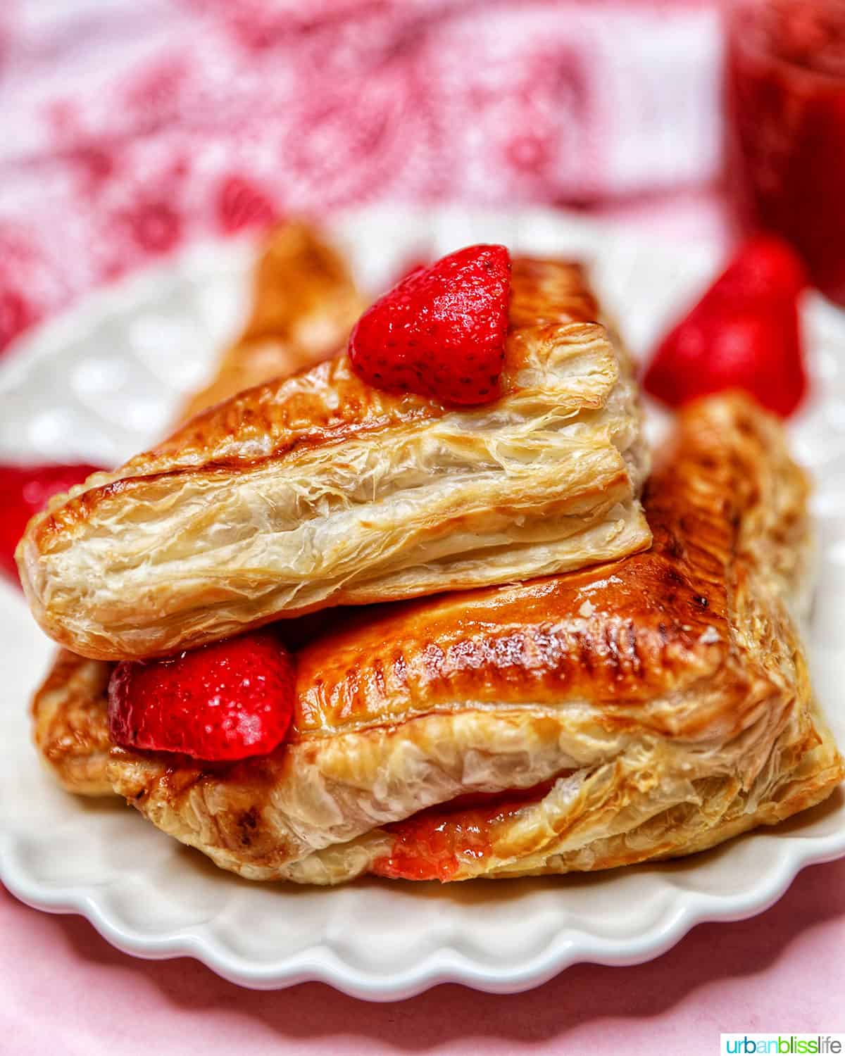 strawberry turnovers closeup stacked on plate