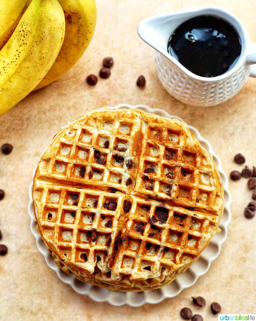 banana chocolate chip waffles with bananas and syrup