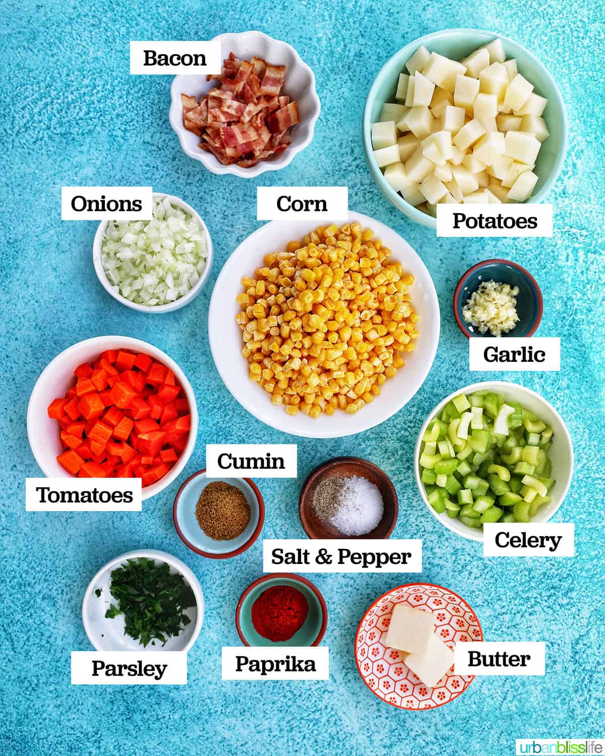 bowls full of individual ingredients to make Instant Pot Potato Corn Chowder on a bright blue background.