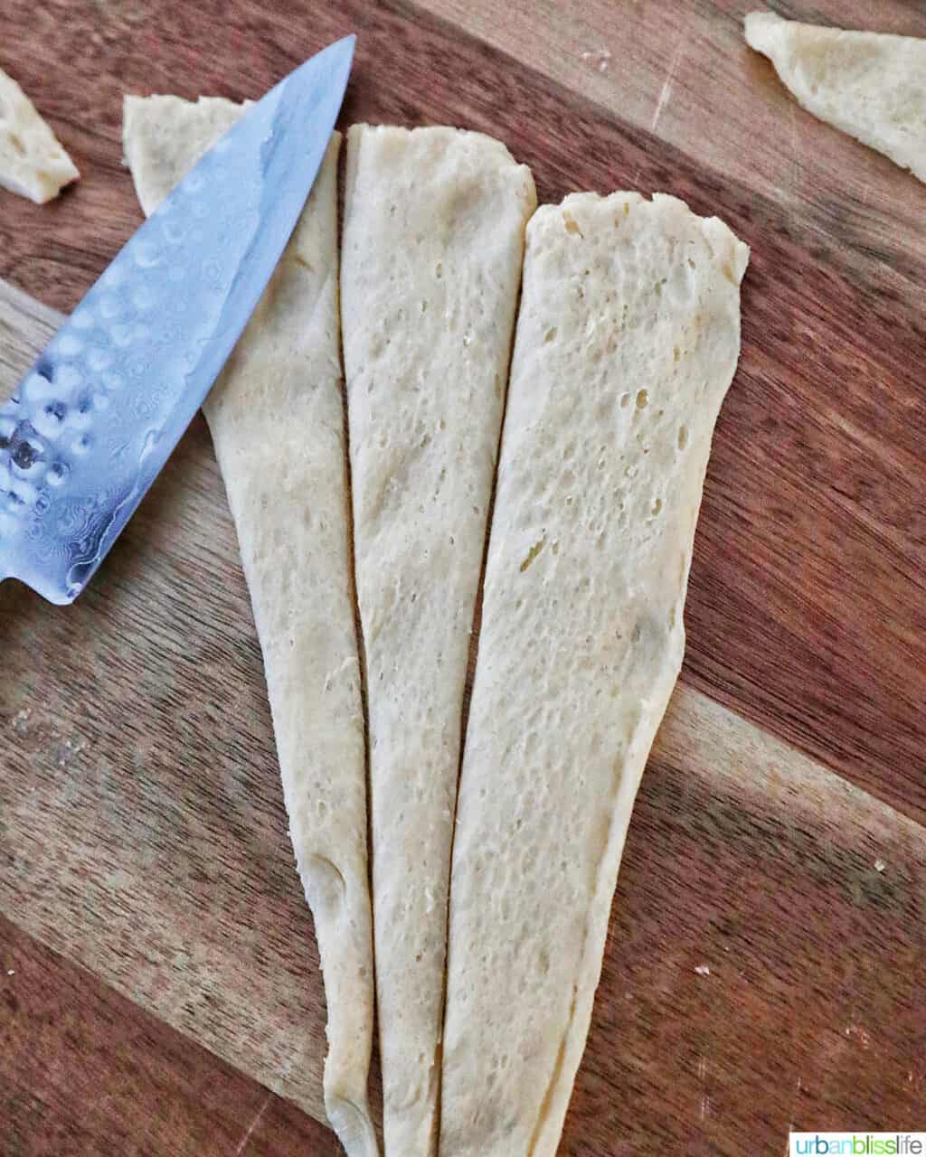 sliced dough triangle into three