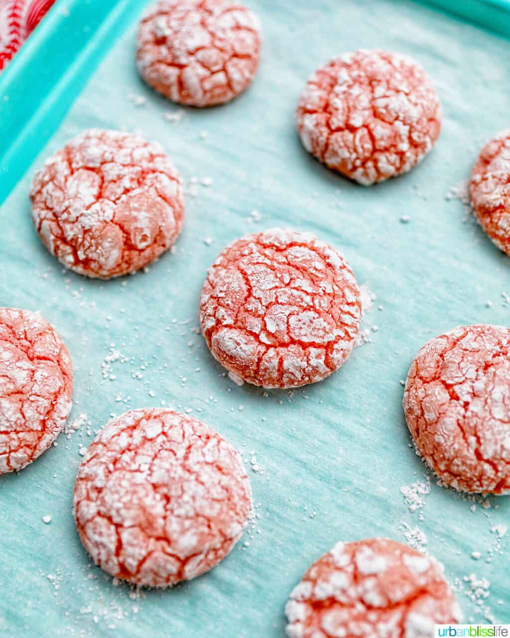 strawberry crinkle cookies cooked on baking sheet