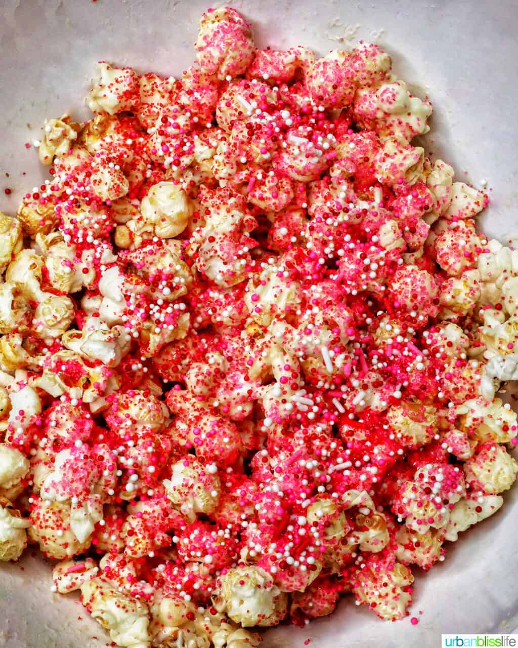 sprinkles over popcorn for Valentine's Day Popcorn
