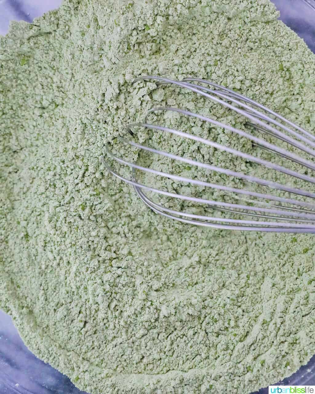 matcha flour mixture with whisk