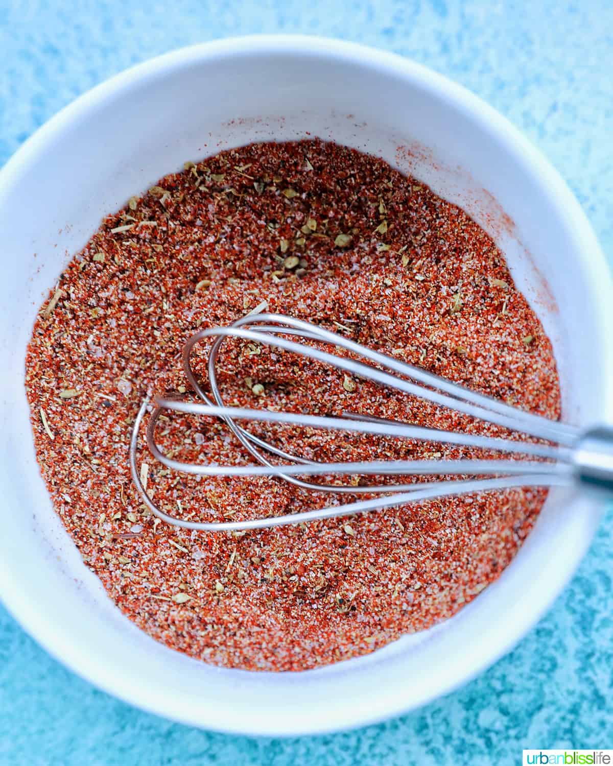 whisking together homemade fajita seasoning