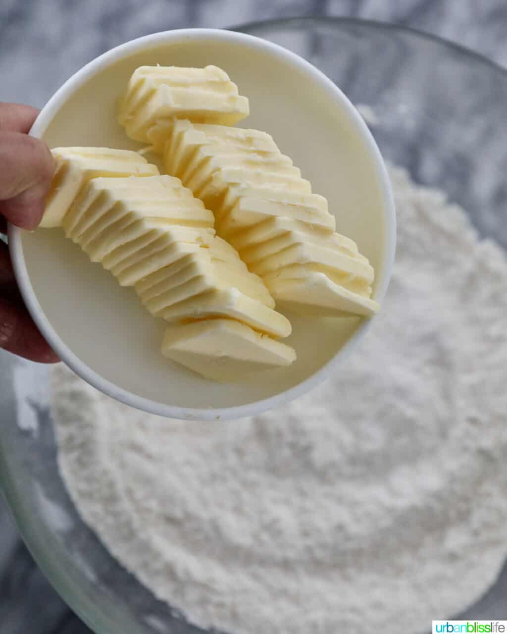 adding butter to flour