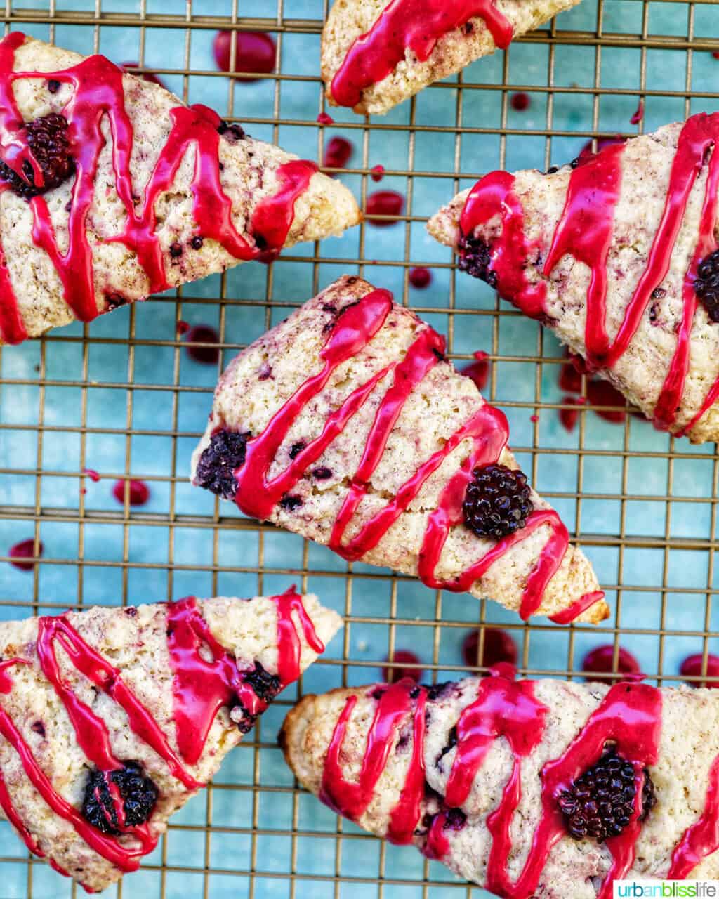 blackberry scones with blackberry glaze on cooling rack