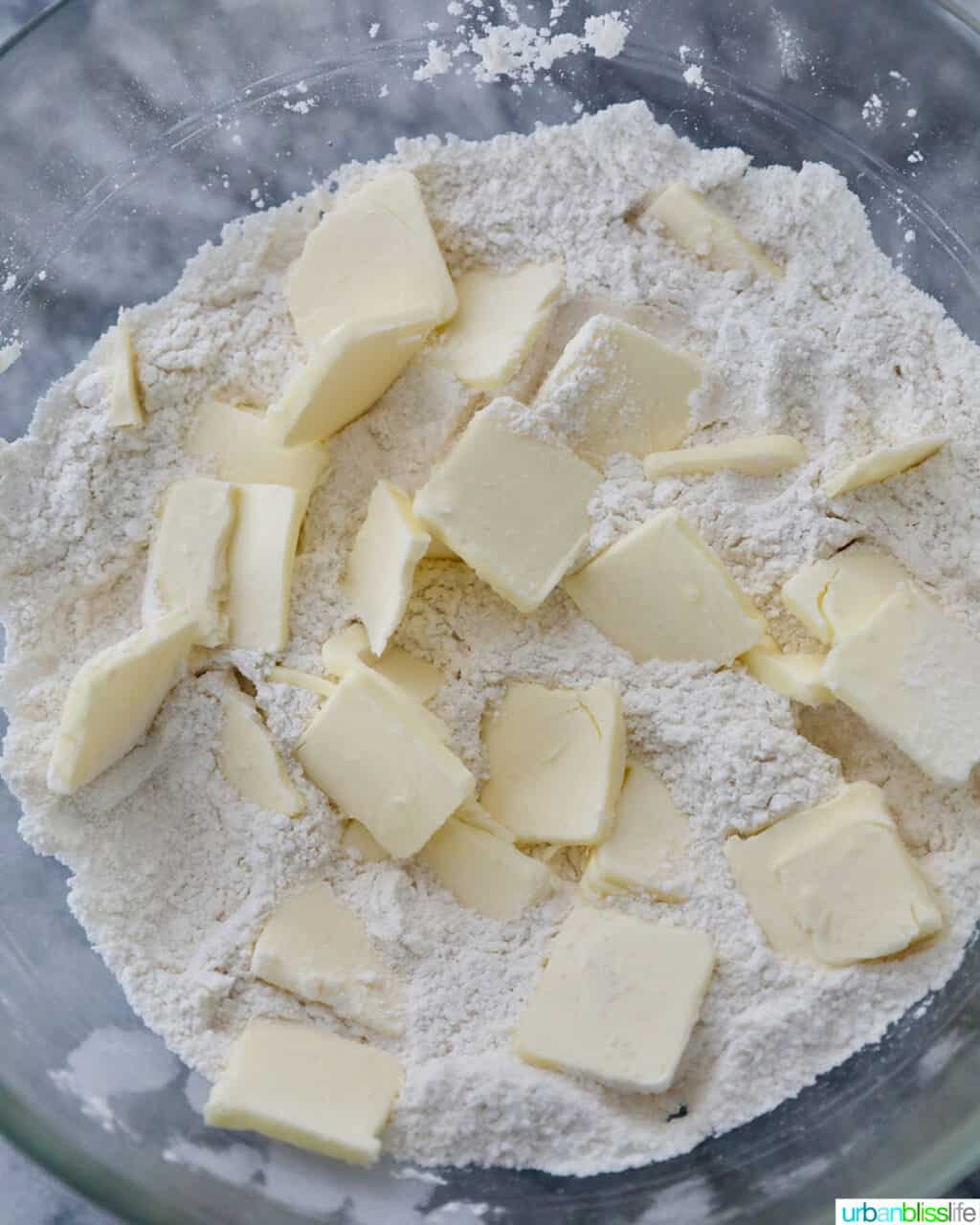 sliced butter into flour