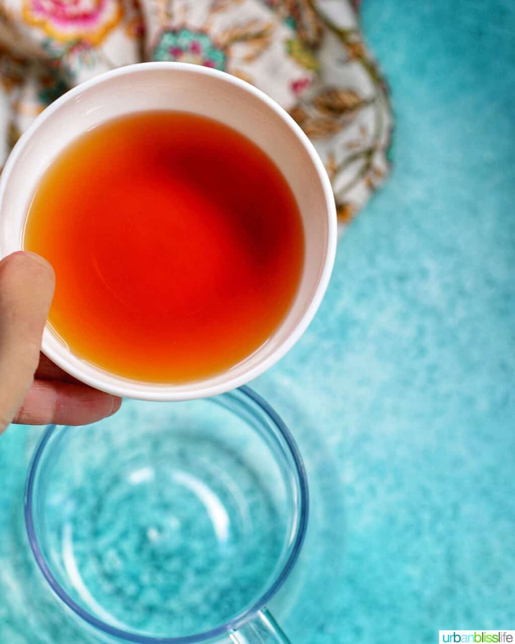 adding orange liqueur into a pitcher