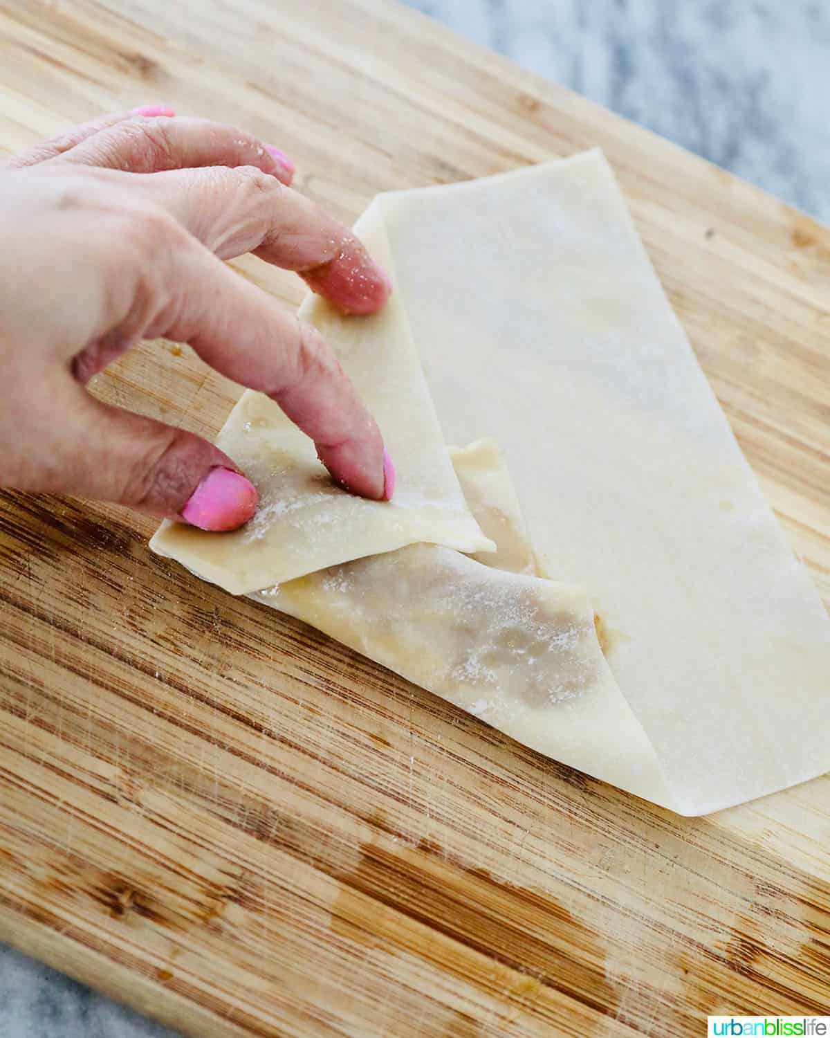 folding Filipino turon banana lumpia