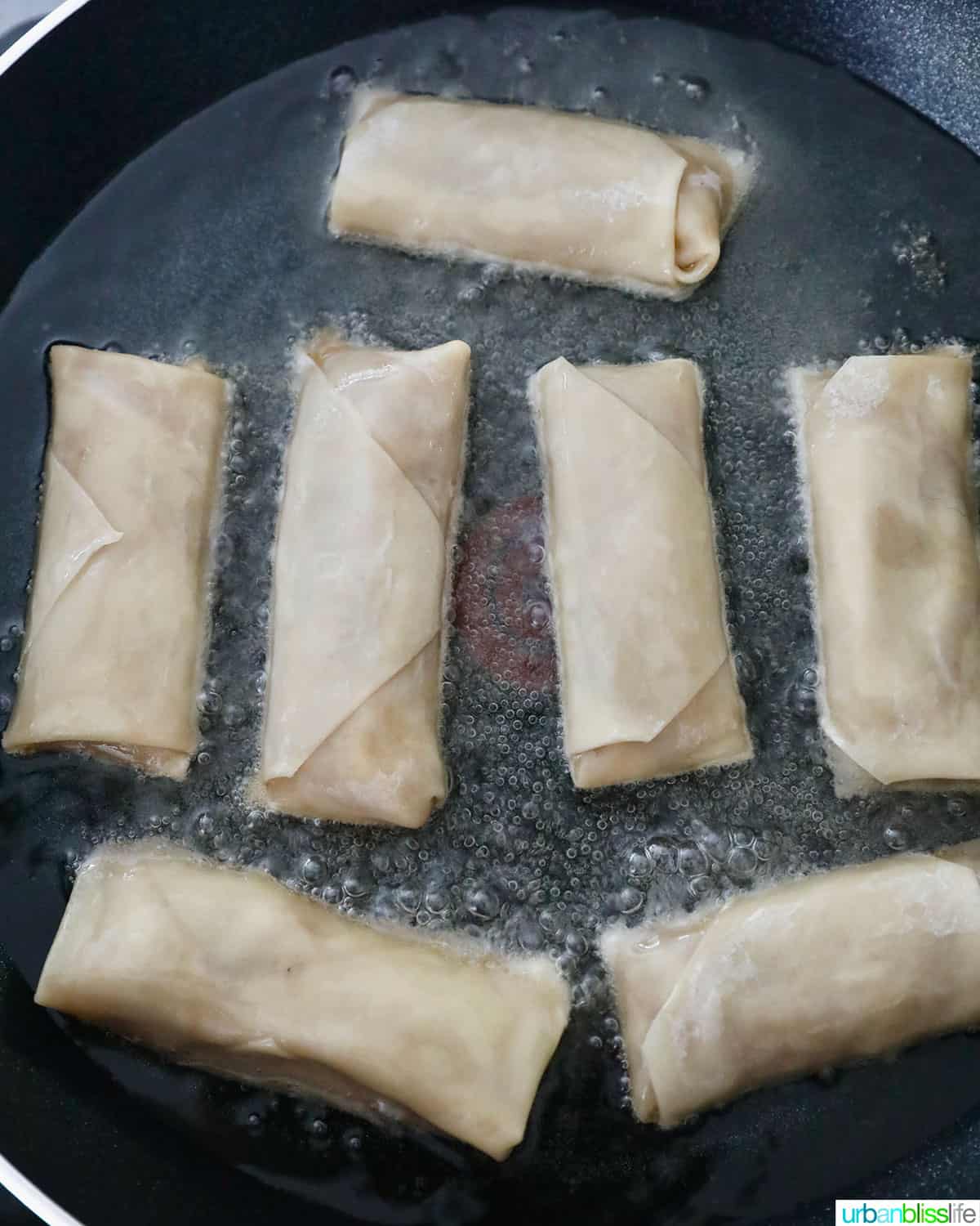 frying Filipino turon banana lumpia