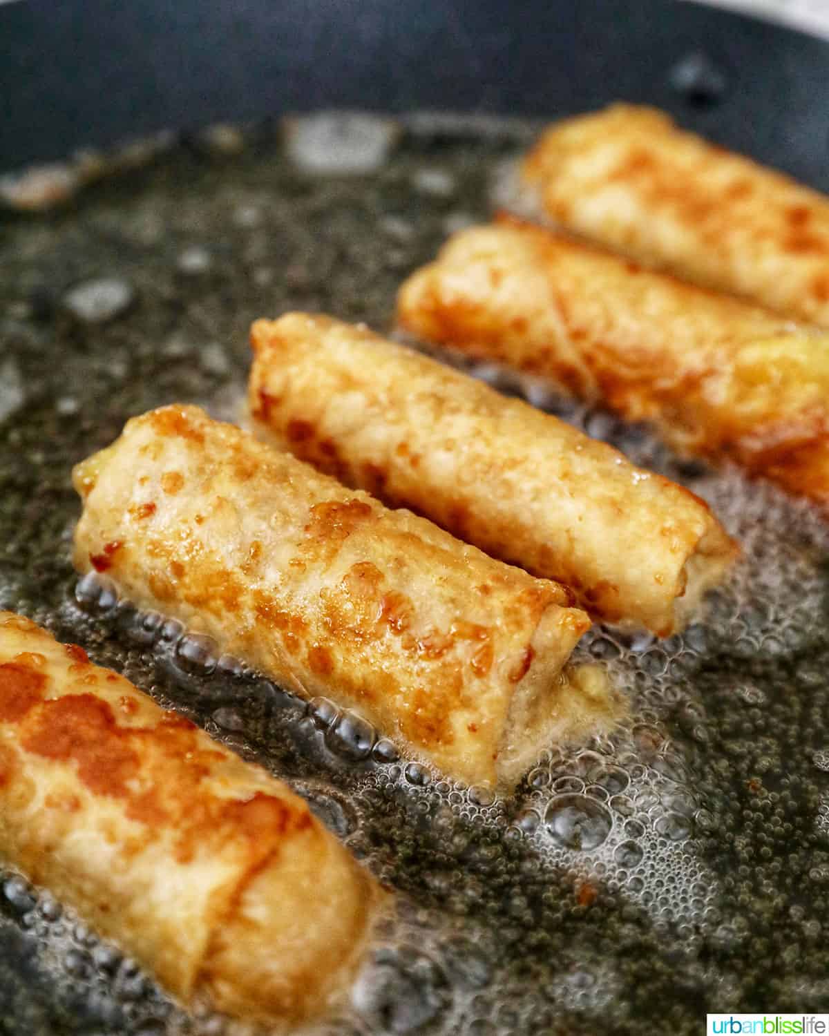 frying Filipino turon banana lumpia