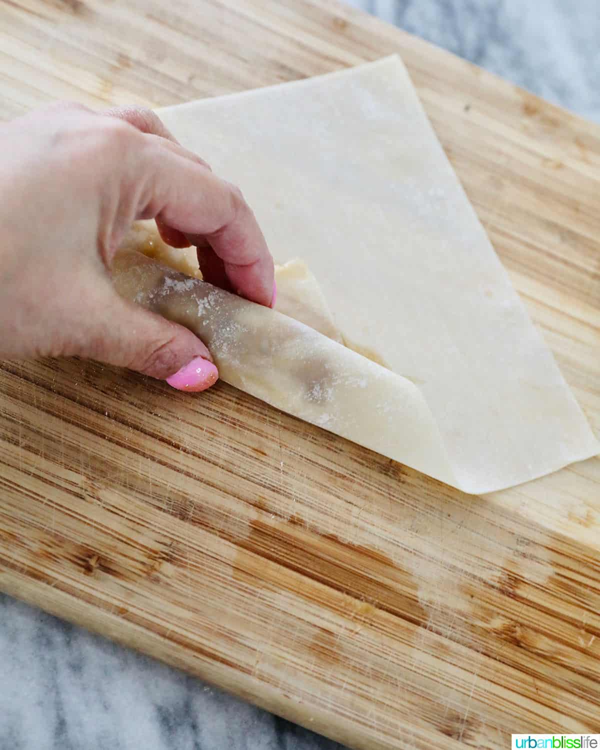 folding Filipino turon banana lumpia