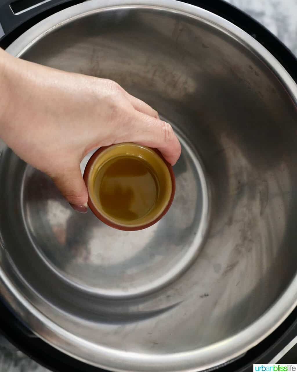 adding olive oil to the instant pot