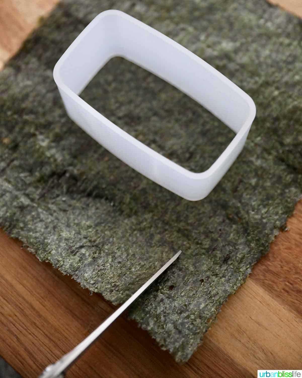 cutting nori seaweed sheets for spam musubi
