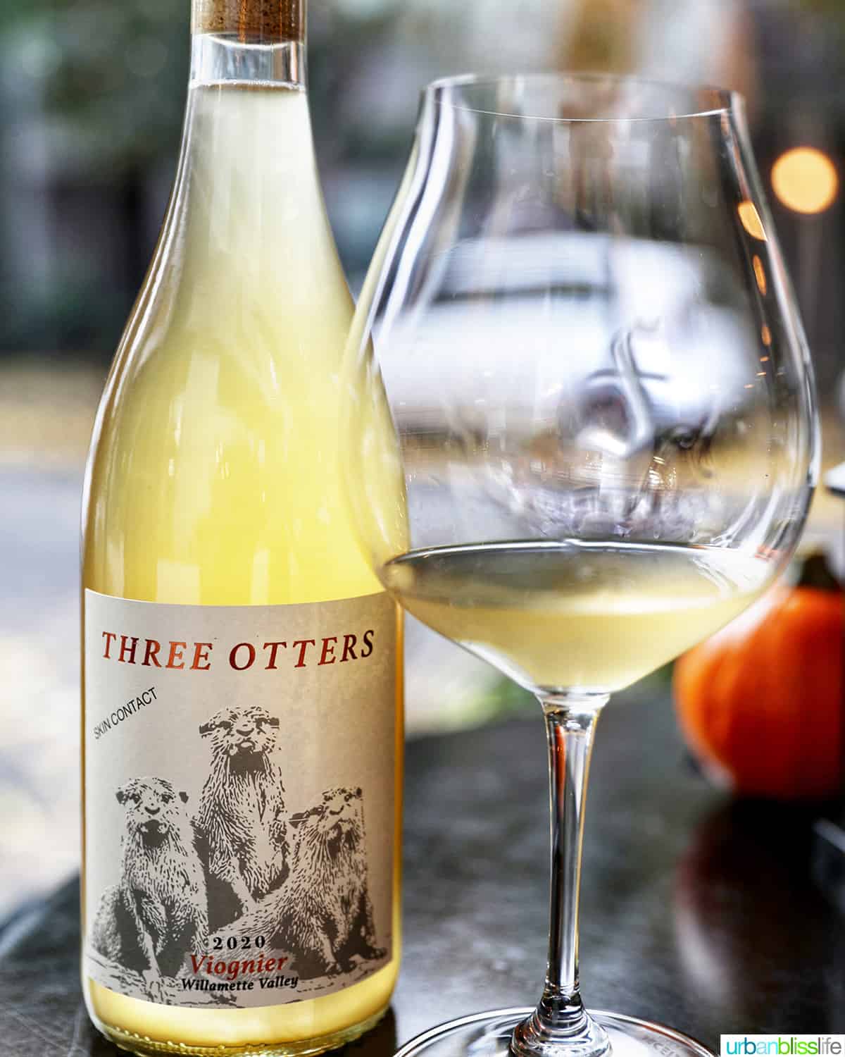 Fullerton Wines Three Otters Viognier wine bottle and glass of wine