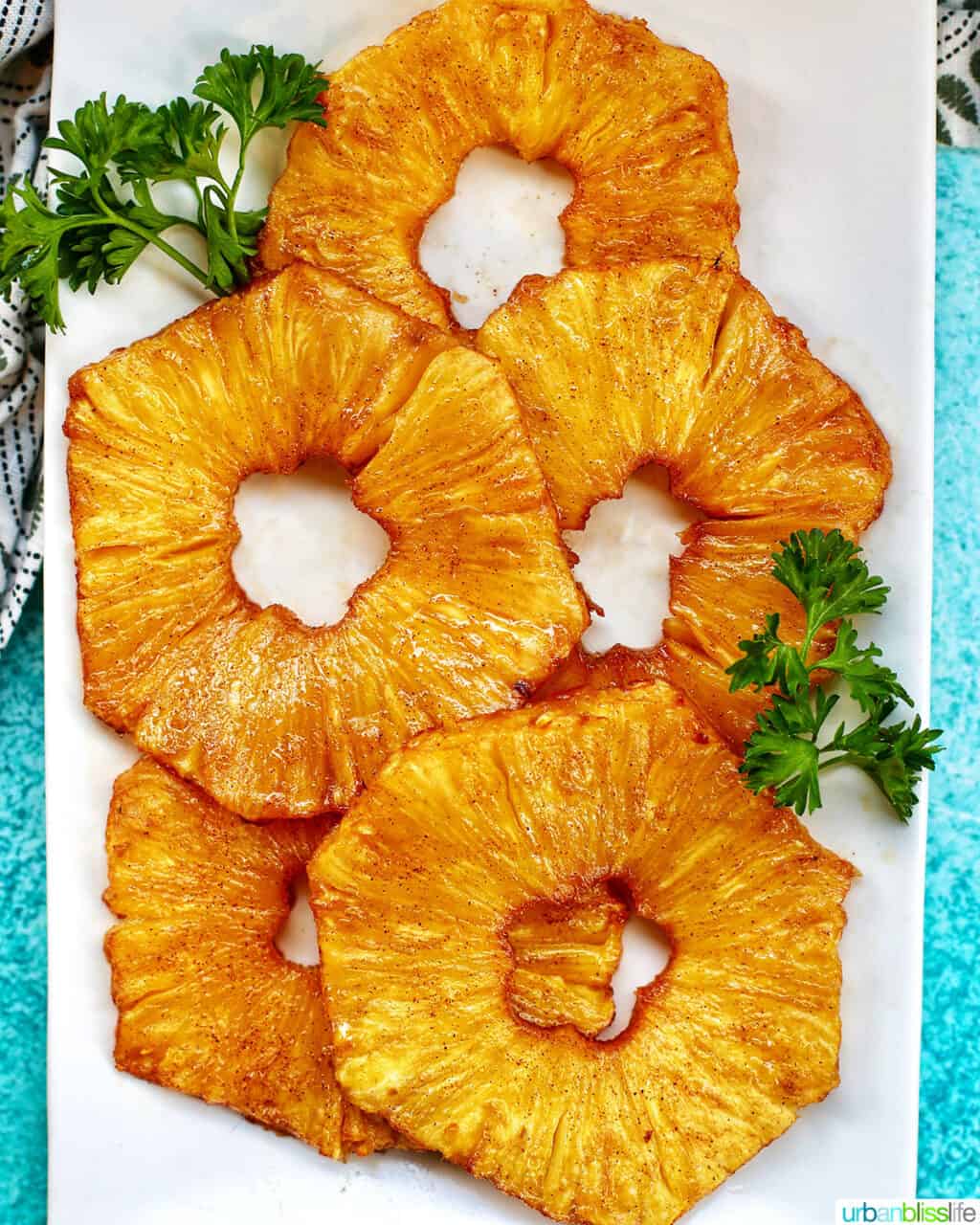 air fryer pineapple slices on a plate