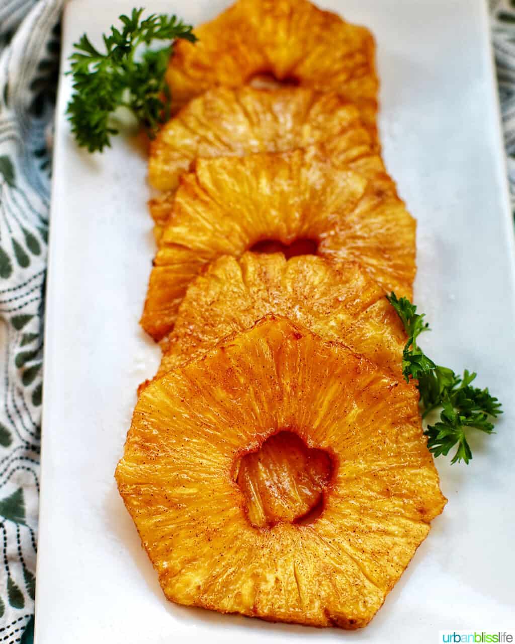 air fryer pineapple slices on a plate