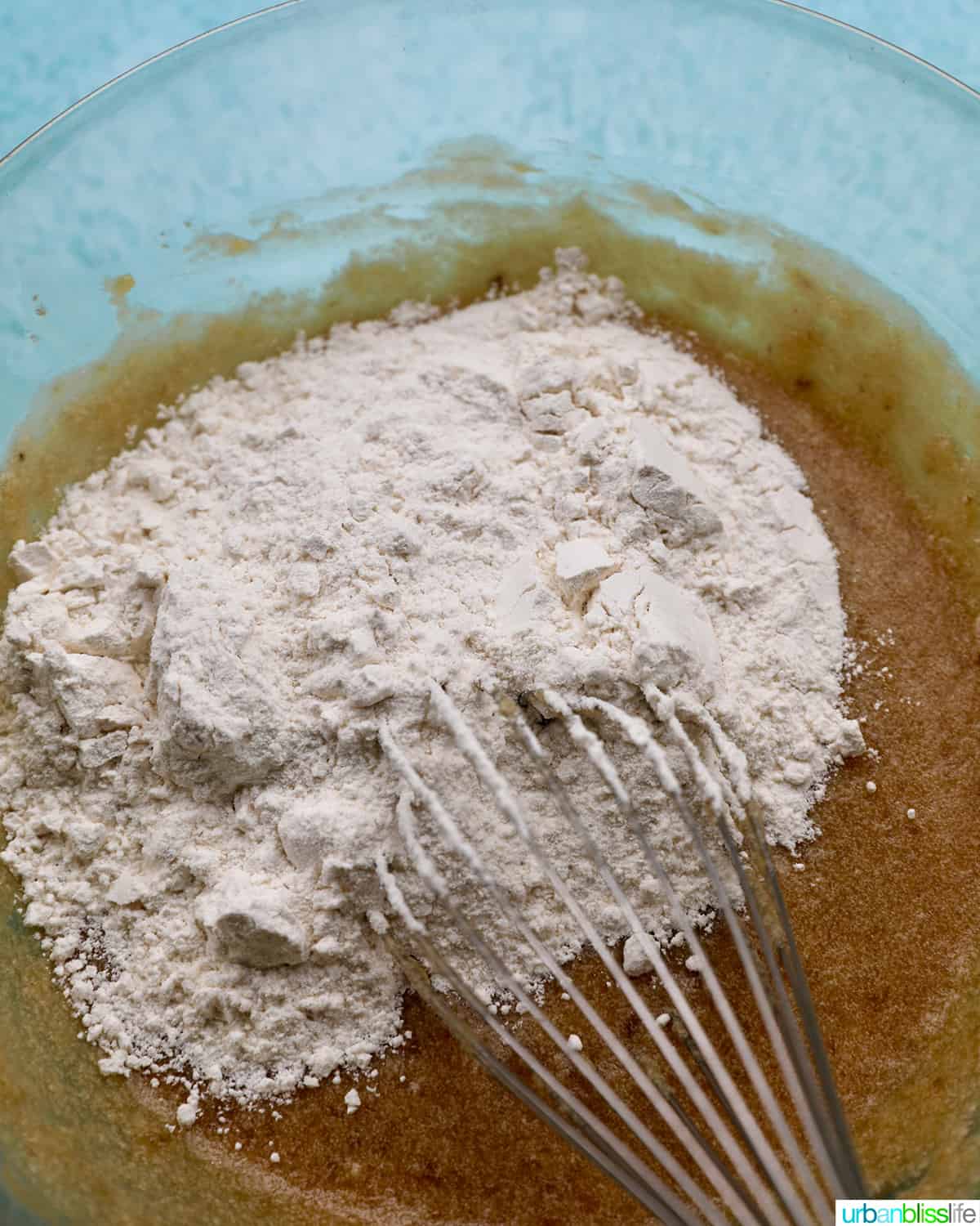 mixing dry ingredients with wet ingredients for cookies