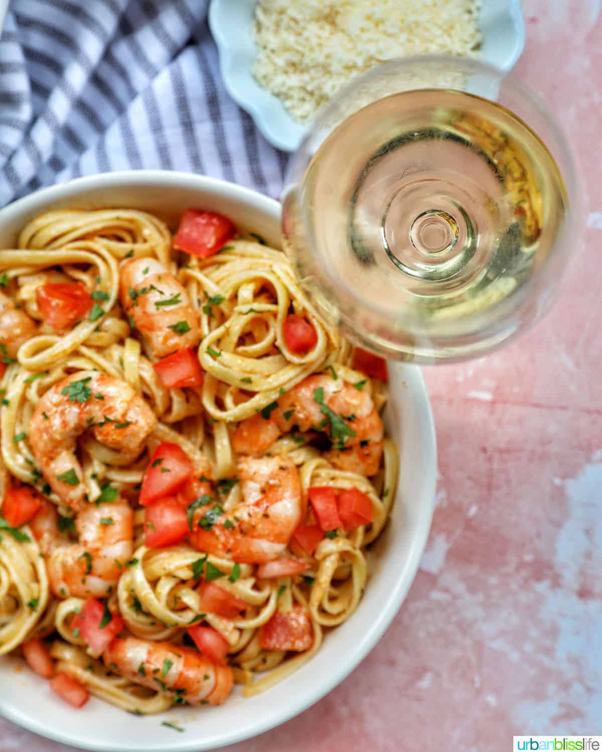 Cajun Shrimp Pasta with glass of white wine