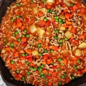 ground pork menudo in a cast iron skillet