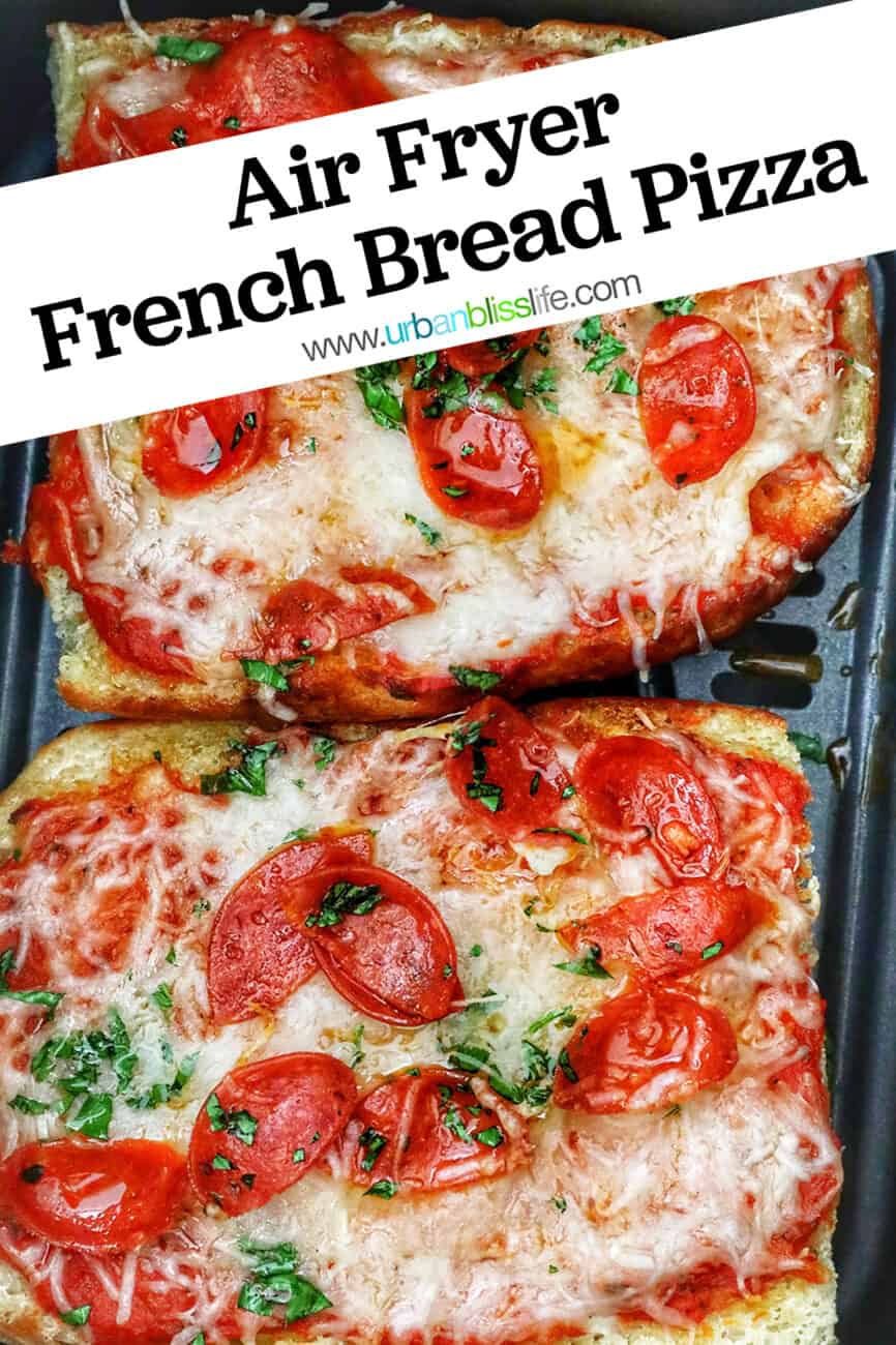 two half loaves of french bread pizza in an air fryer basket with title text overlay.