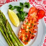 air fryer lobster tail with asparagus and lemon.