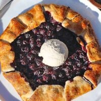 blueberry galette with a scoop of vanilla ice cream on top.