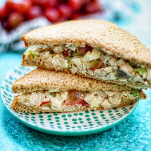 classic chicken salad sandwiches in a stack.