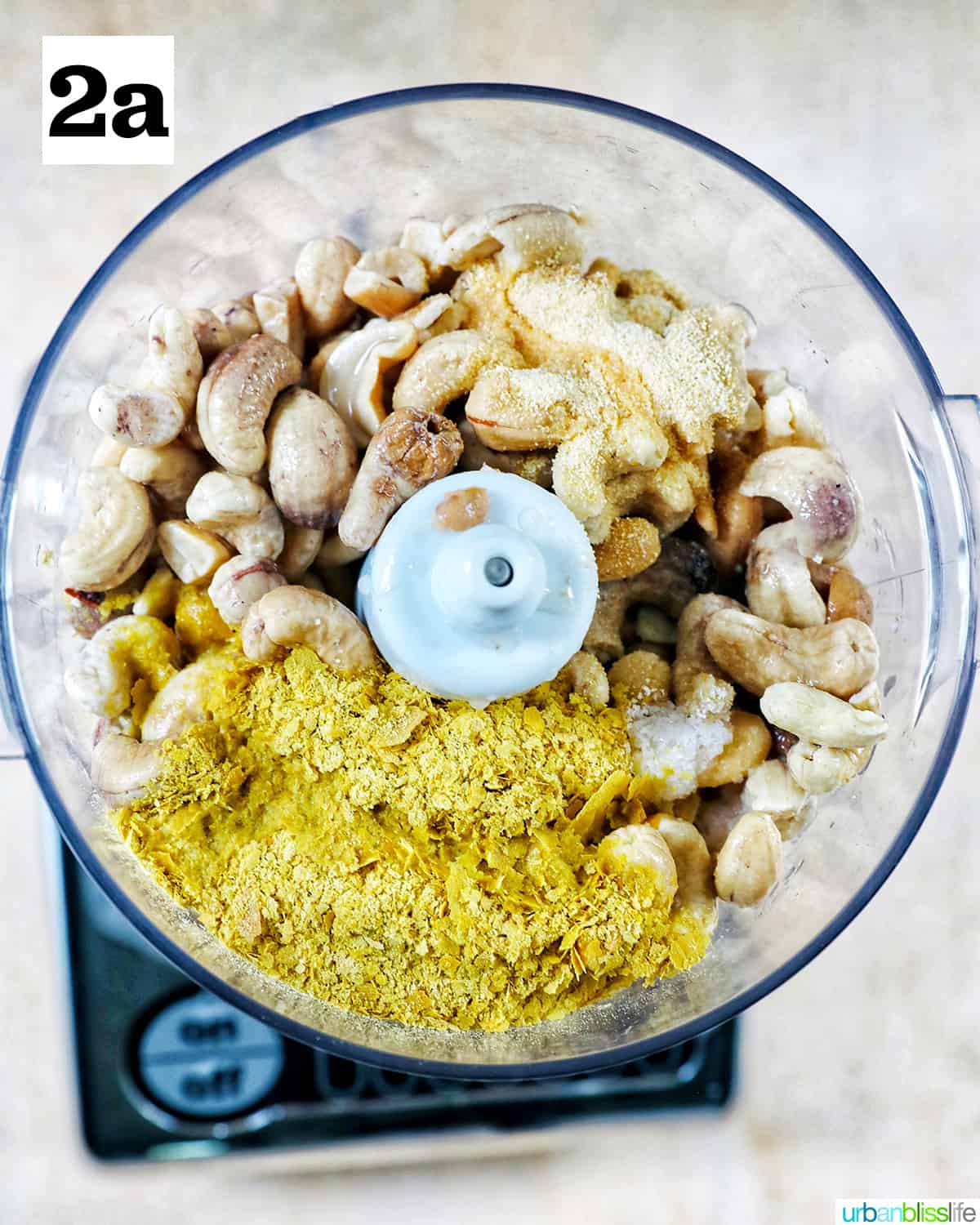 ingredients to make cashew cheese in a food processor.