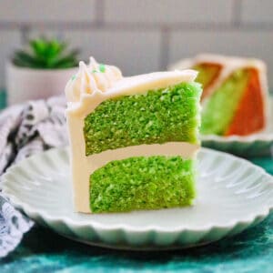 slide of green velvet cake with cream cheese frosting.