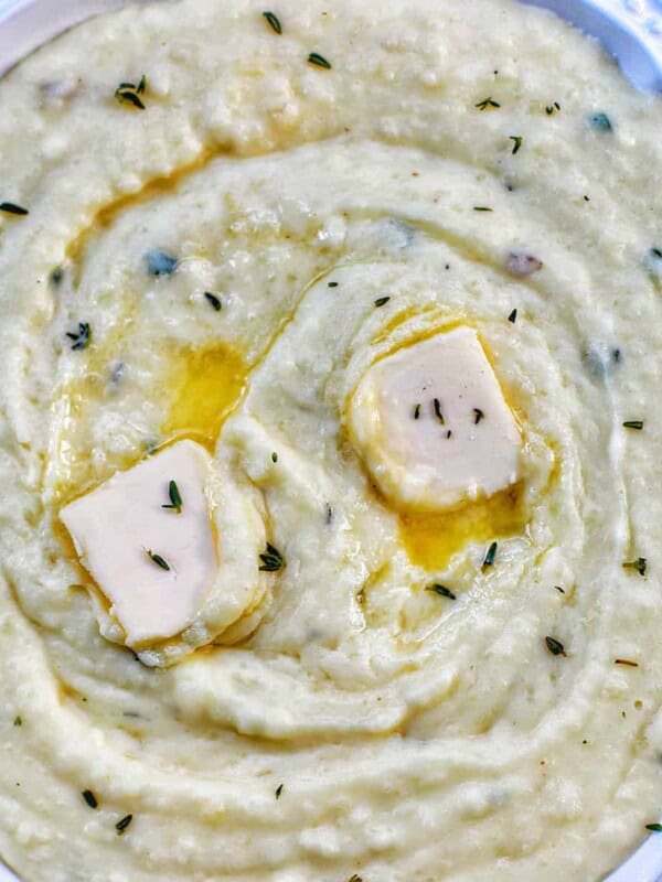 instant pot garlic mashed potatoes with two dabs of butter on top.