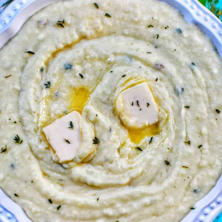 instant pot garlic mashed potatoes with two dabs of butter on top.