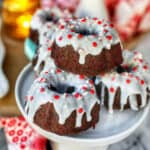 mini gingerbread bundt cakes with white icing and sprinkles.