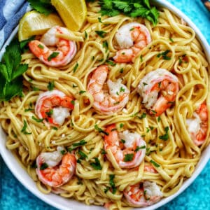 shrimp scampi linguine with parsley in a bowl.
