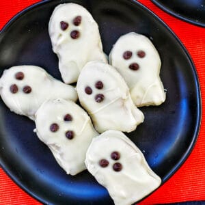 nutter butter ghost cookies on a plate.