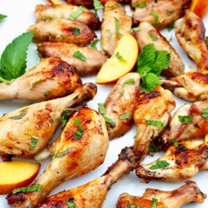 peach bourbon grilled chicken with peach slices.