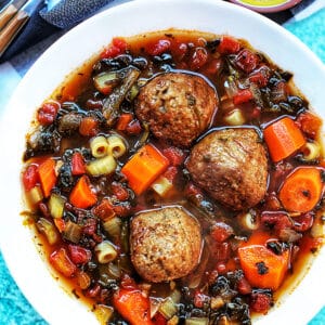 slow cooker meatball soup with carrots and pasta.