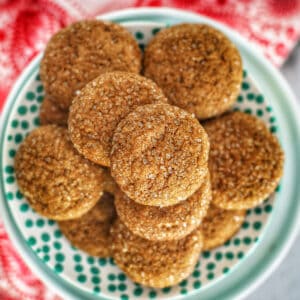 soft ginger molasses cookies on a patterned plate.