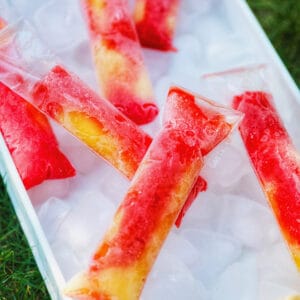 tequila sunset frozen pops over a bed of ice.