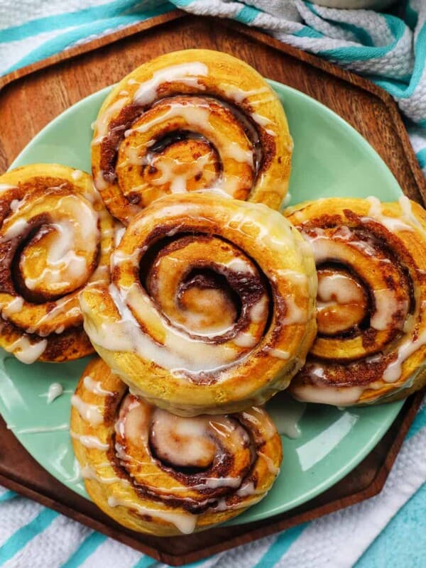 air fryer cinnamon rolls with icing drizzle.