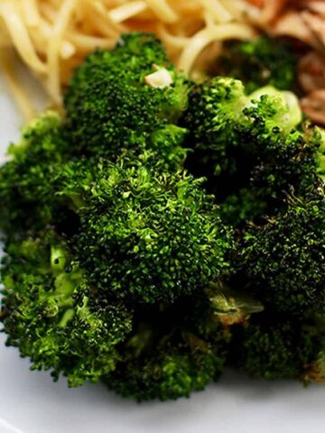air fryer broccoli on plate with pasta.